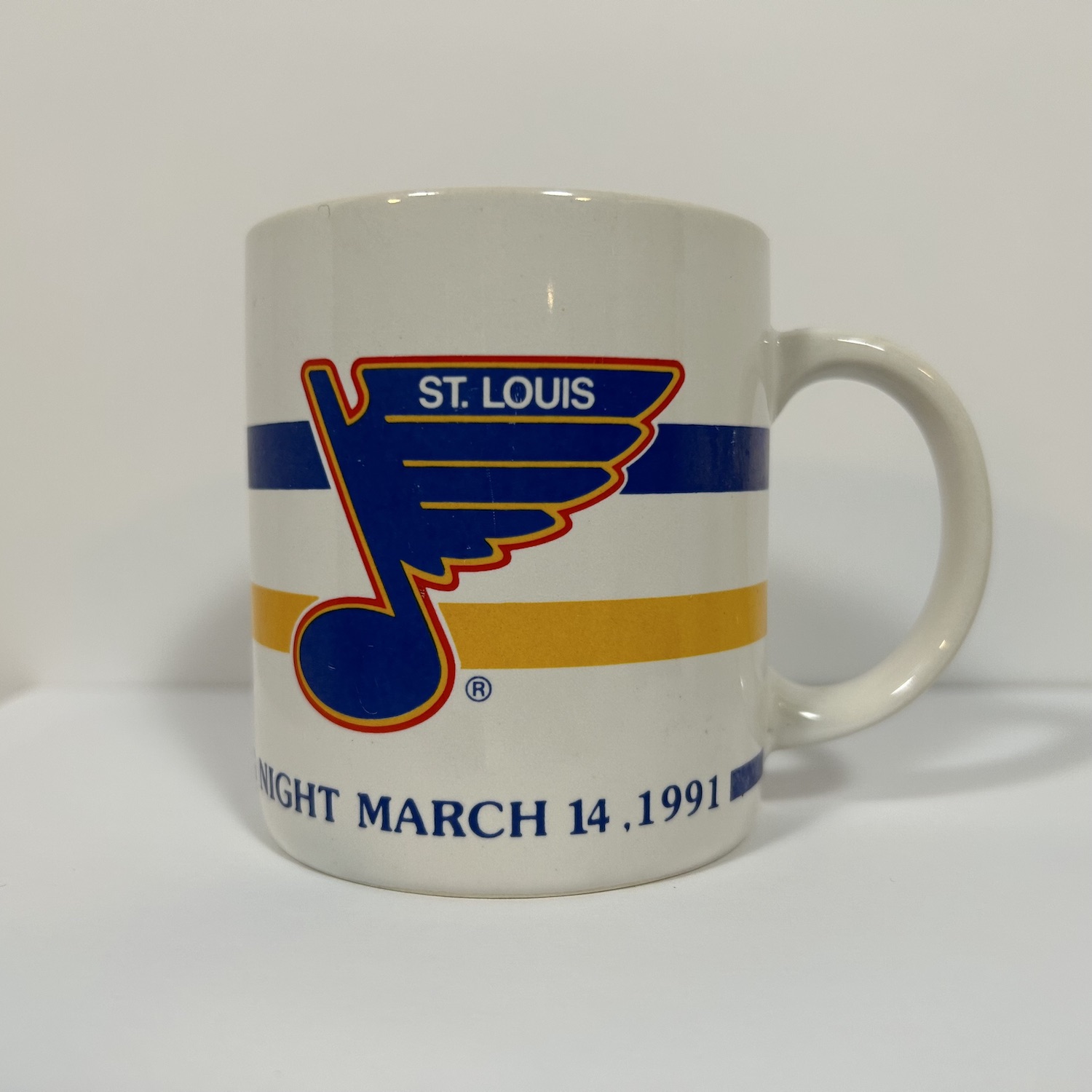 vintage white coffee mug with retro blues logo and game giveaway date